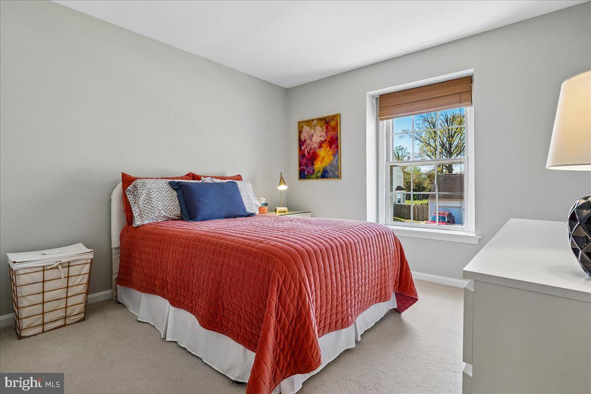 7801 Blue Jasmine Court Springfield, VA 22153 - Photo 30 of 61 a bedroom with a bed and a window
