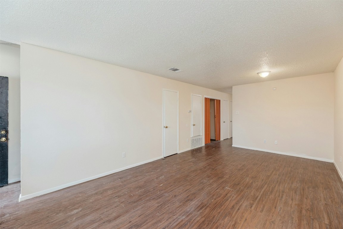 8412 Garcreek Circle Austin, TX 78724 - Photo 24 of 40 Entering Unit B, the stairway sits in front of the door while the living area stretches across the heart of the home and flows into the kitchen.