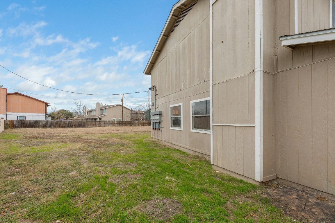 8412 Garcreek Circle Austin, TX 78724 - Photo 35 of 40 A wide open space alongside the fourplex provides potential for a driveway leading to added units in the acreage behind the existing complex.