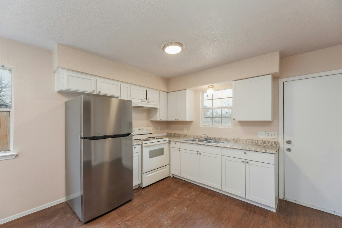 8412 Garcreek Circle Austin, TX 78724 - Photo 7 of 40 The kitchens offer a dining area and electric ranges, dishwashers, and fridges.