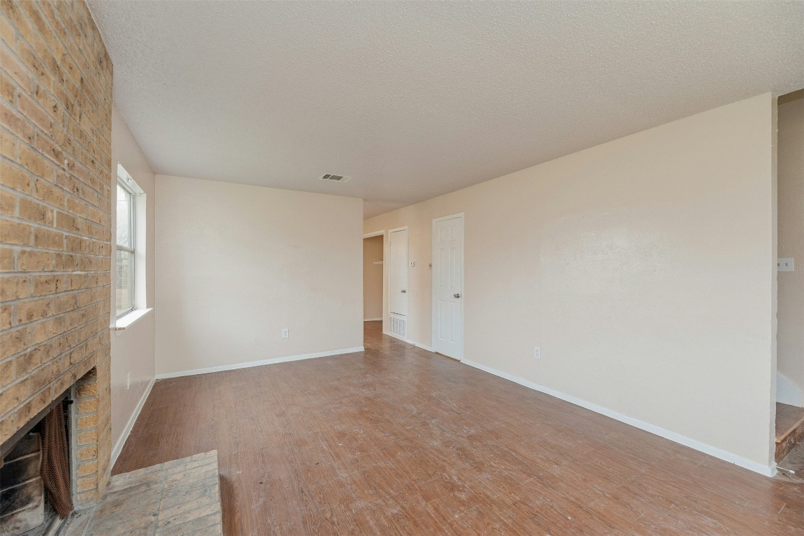 8412 Garcreek Circle Austin, TX 78724 - Photo 10 of 40 Unit A's living area benefits from the exterior side wall with a window that infuses peaceful natural light into the unit making it desirable for potential renters.