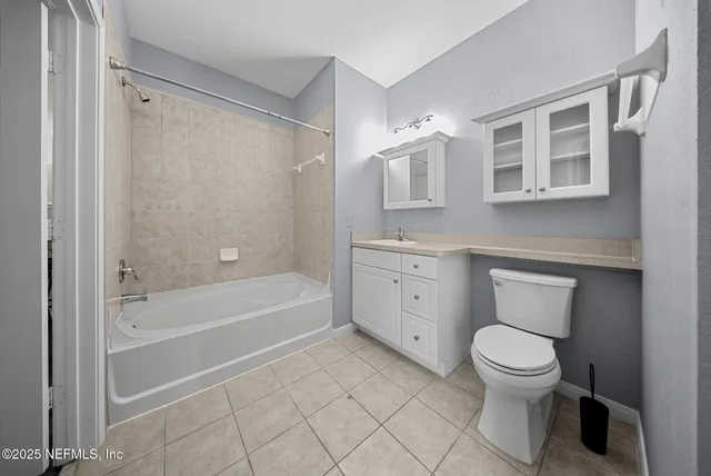 a bathroom with a toilet sink and bathtub