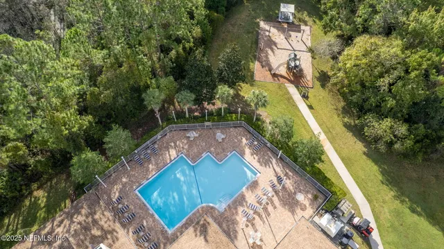 a view of a park with large trees
