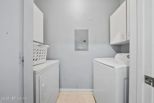 a utility room with dryer and washer