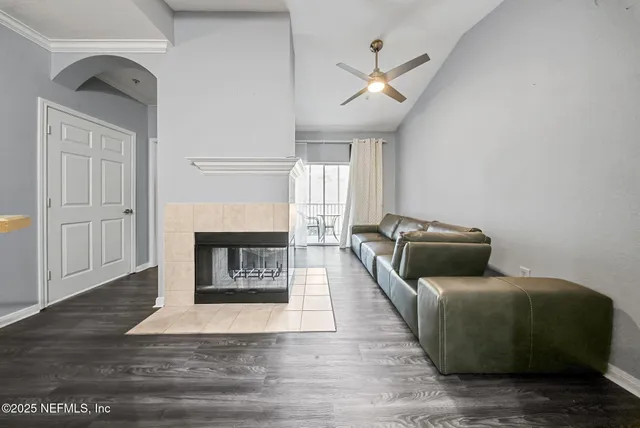 a living room with furniture and a fireplace