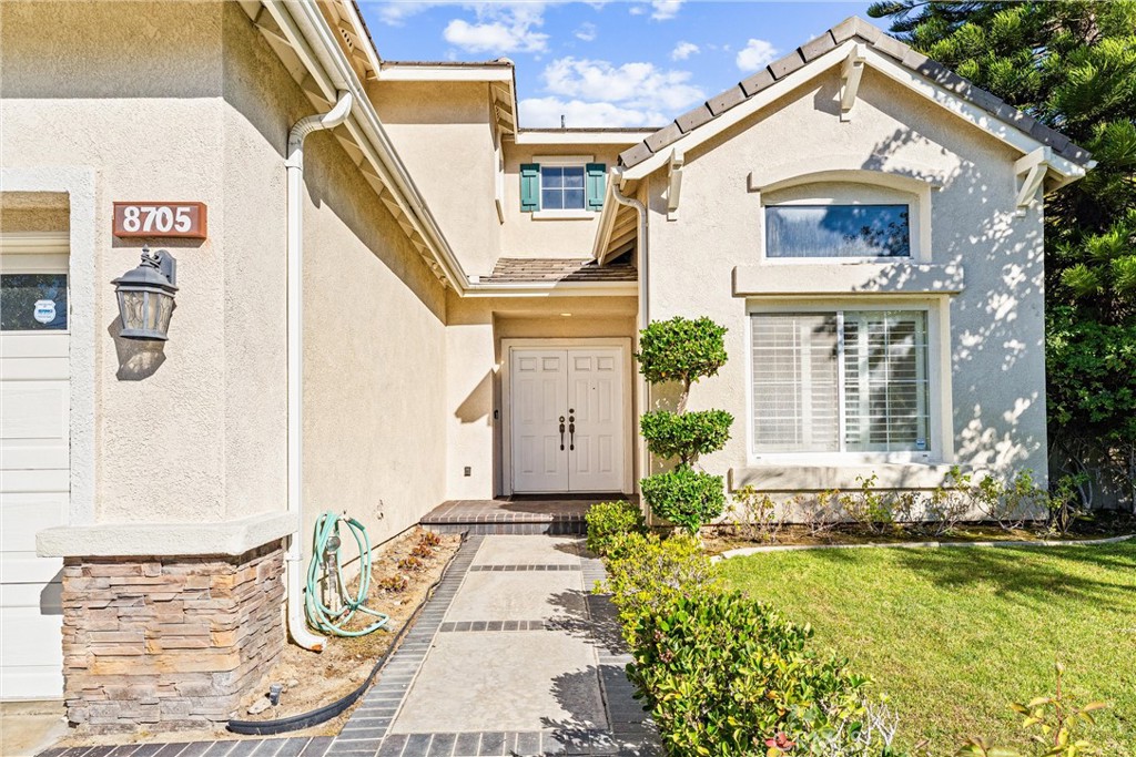 8705 Running Springs Drive Anaheim, CA 92808 - Photo 2 of 37 a front view of a house with garden