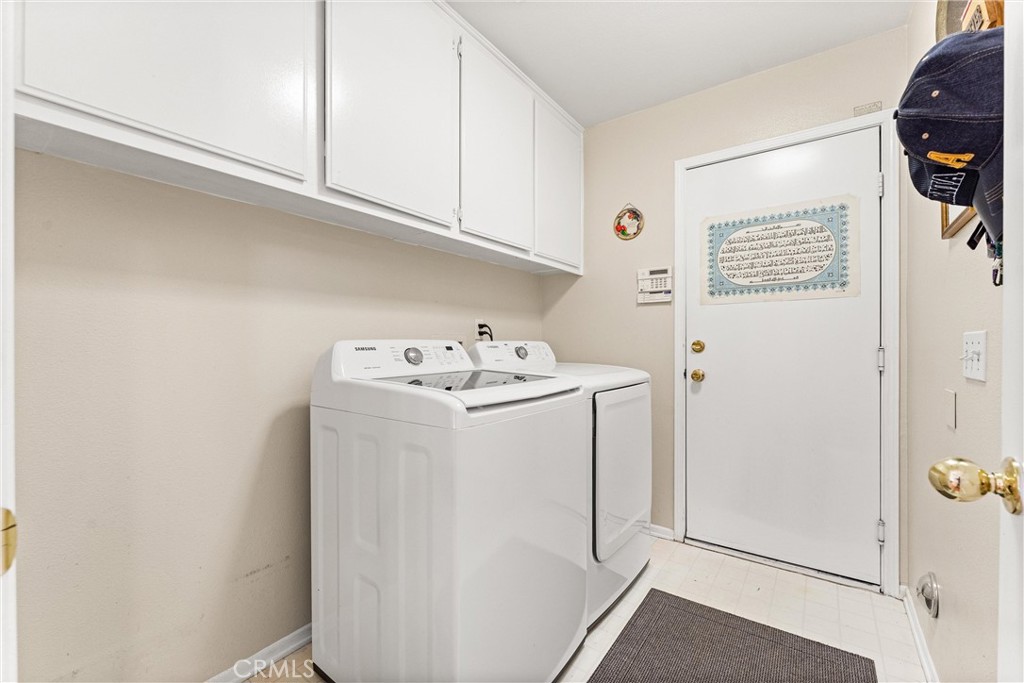 8705 Running Springs Drive Anaheim, CA 92808 - Photo 21 of 37 a utility room with dryer and washer