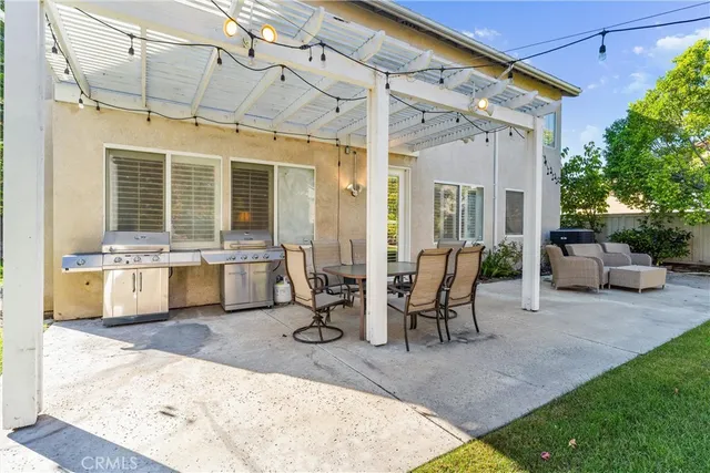 a view of a dinning table and chairs in the patio
