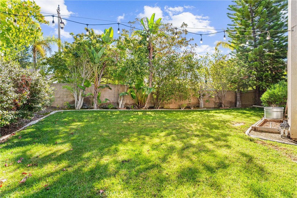 8705 Running Springs Drive Anaheim, CA 92808 - Photo 28 of 37 a front view of a house with garden
