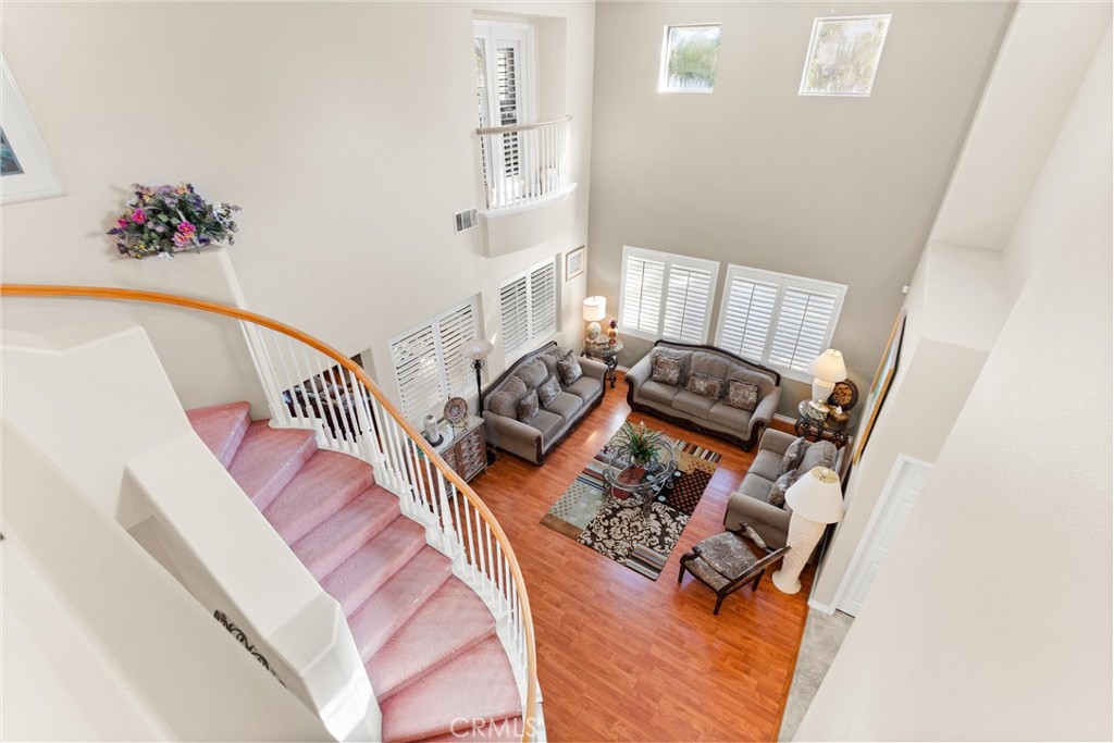 8705 Running Springs Drive Anaheim, CA 92808 - Photo 29 of 37 a bedroom with furniture and a wooden floor