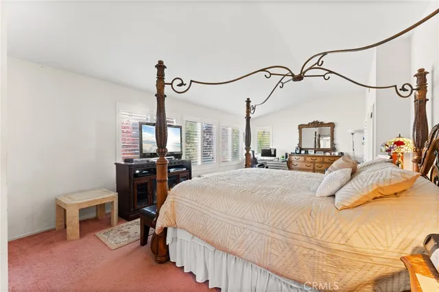 a bed room with a bed and a chandelier