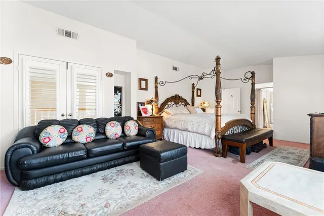 a living room with furniture a couch and a table