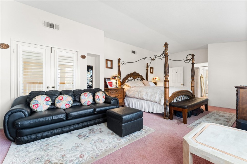8705 Running Springs Drive Anaheim, CA 92808 - Photo 31 of 37 a living room with furniture a couch and a table