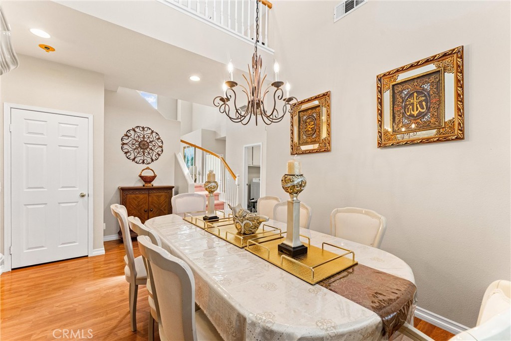 8705 Running Springs Drive Anaheim, CA 92808 - Photo 7 of 37 a view of a dining room with furniture and wooden floor