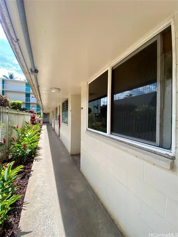 a view of a pathway both side of house