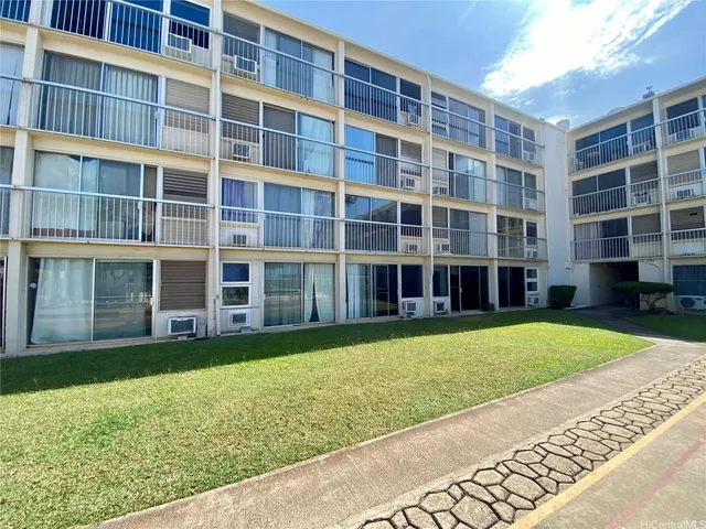 a view of building with yard