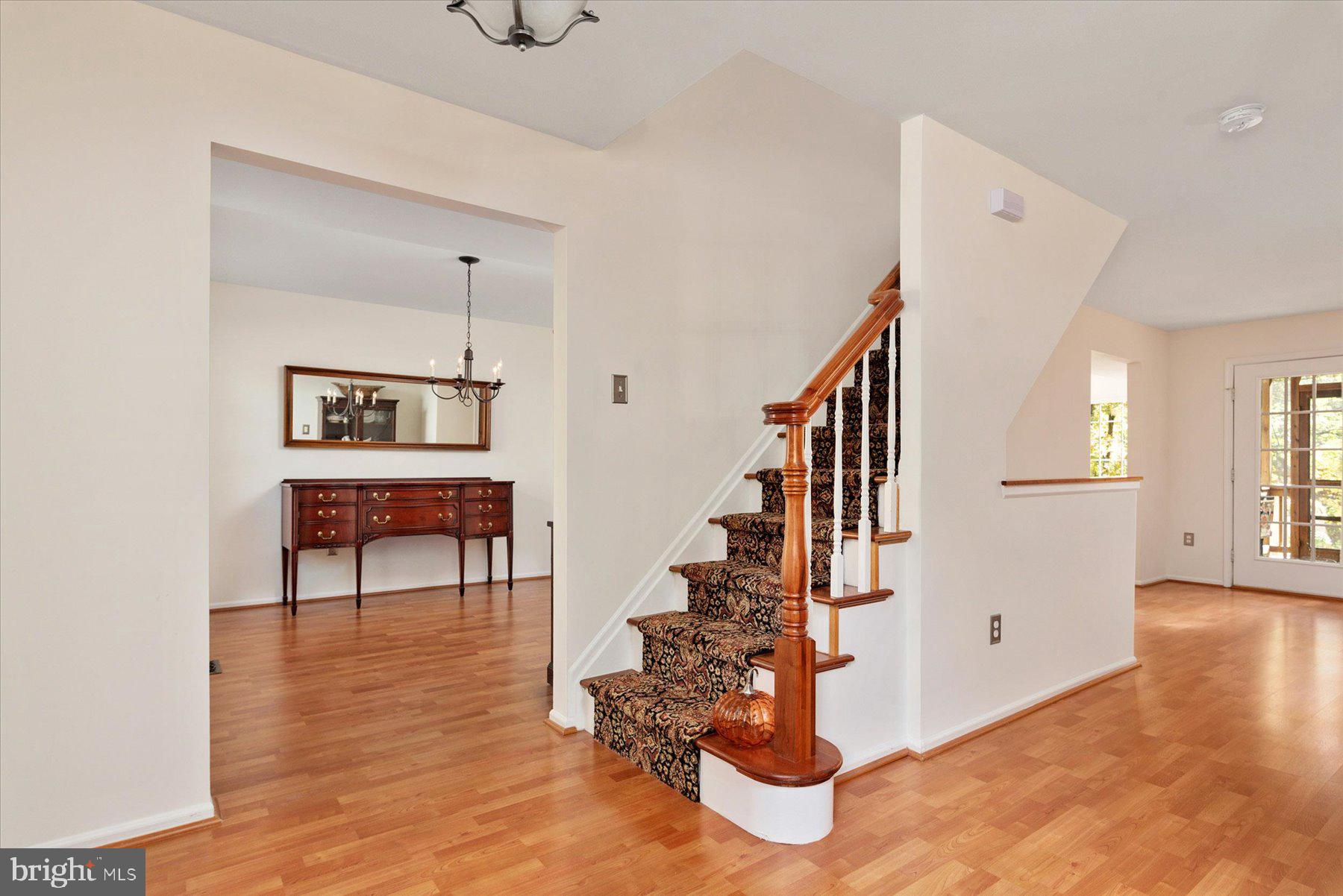 9337 Spring Water Path Jessup, MD 20794 - Photo 15 of 41 a view of entryway livingroom and hall with wooden floor