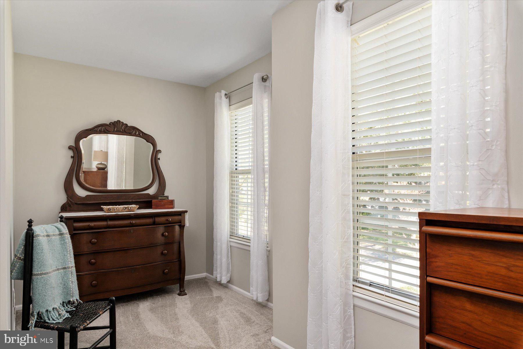 9337 Spring Water Path Jessup, MD 20794 - Photo 18 of 41 a living room with a bed furniture and a window