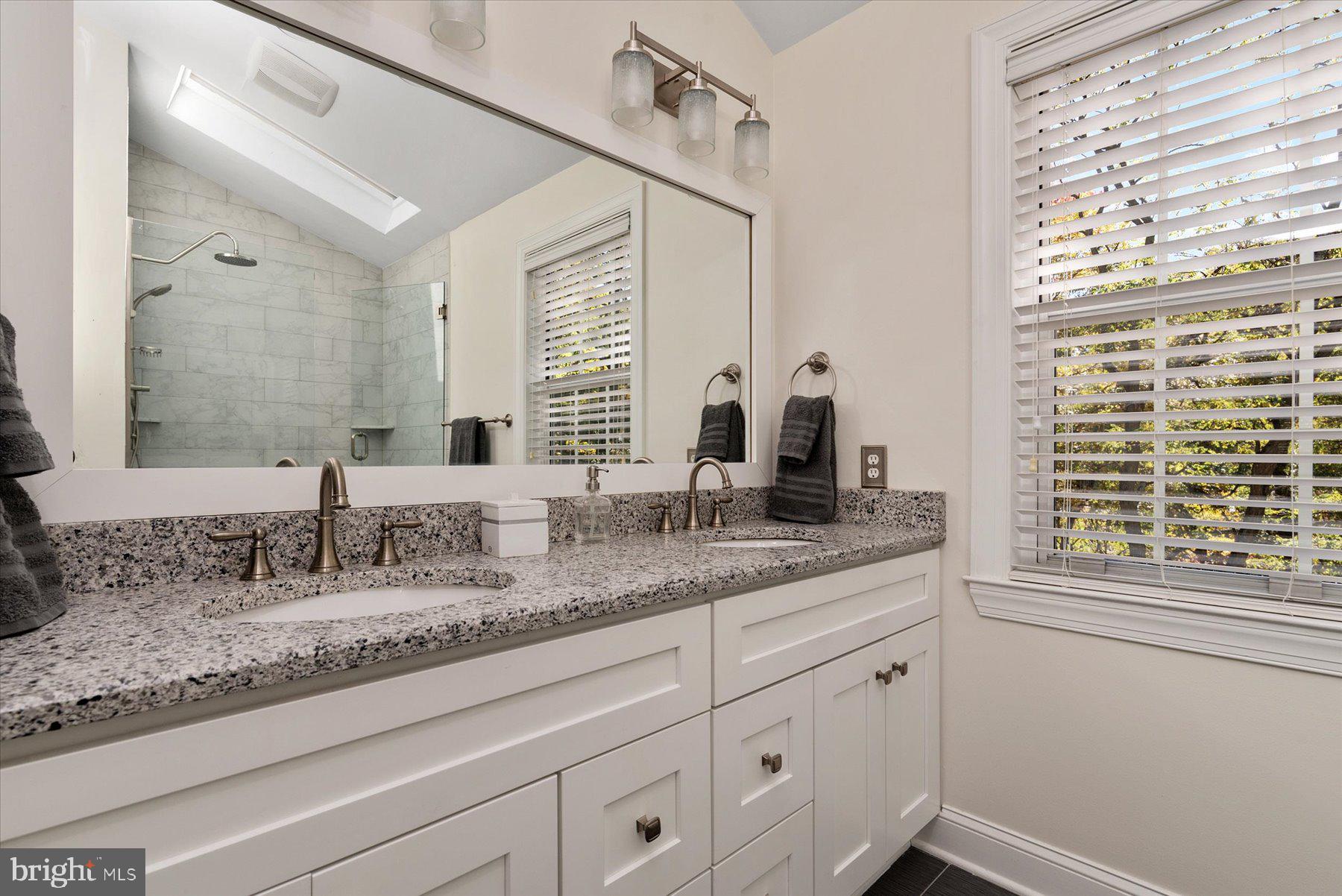 9337 Spring Water Path Jessup, MD 20794 - Photo 19 of 41 a bathroom with double vanity and a window