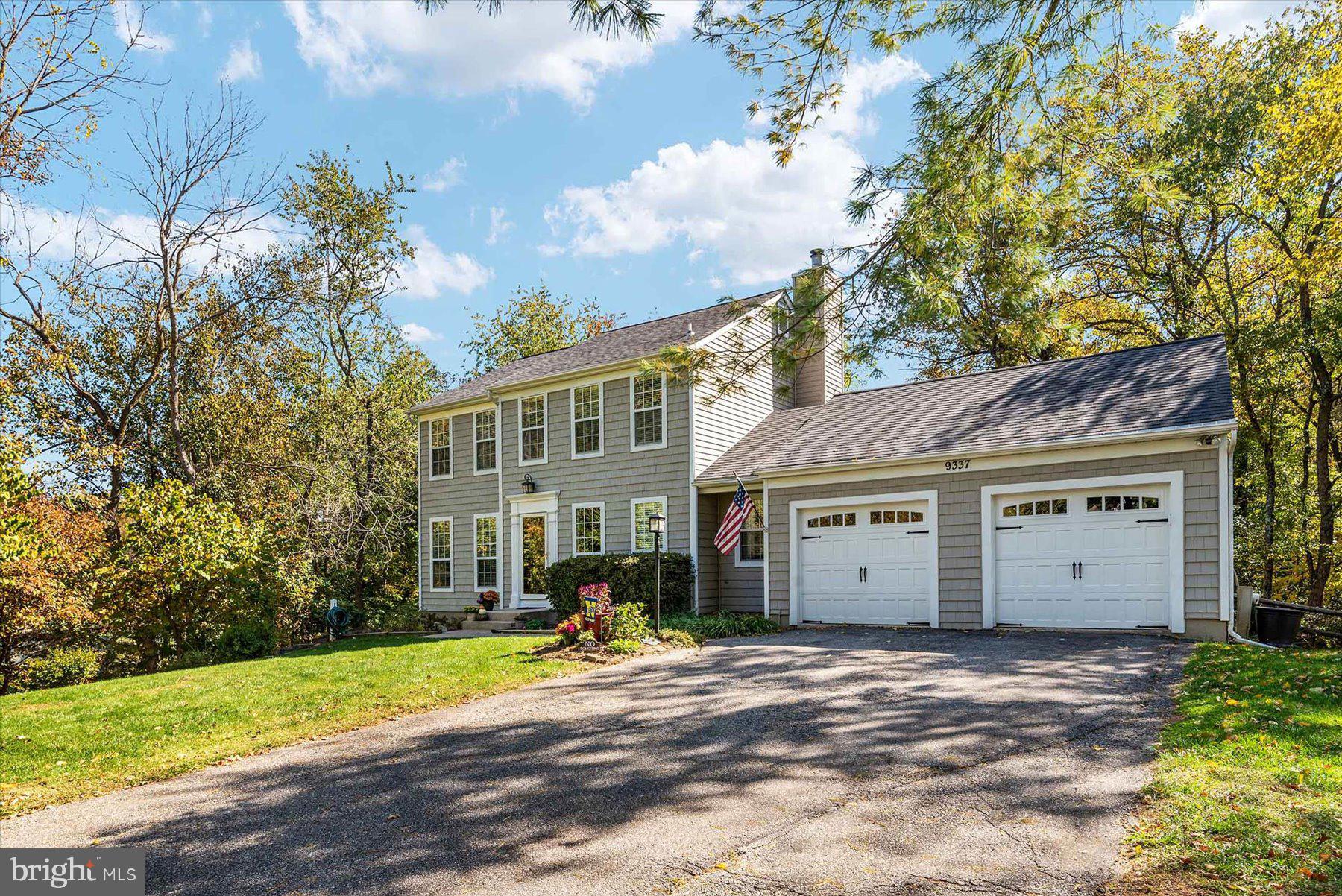 9337 Spring Water Path Jessup, MD 20794 - Photo 2 of 41 a view of a house with a yard and potted plants