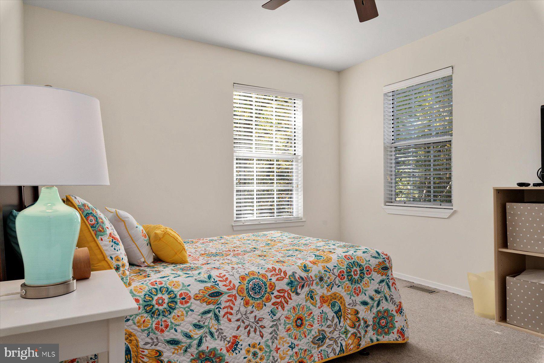 9337 Spring Water Path Jessup, MD 20794 - Photo 21 of 41 a bedroom with a bed and large window