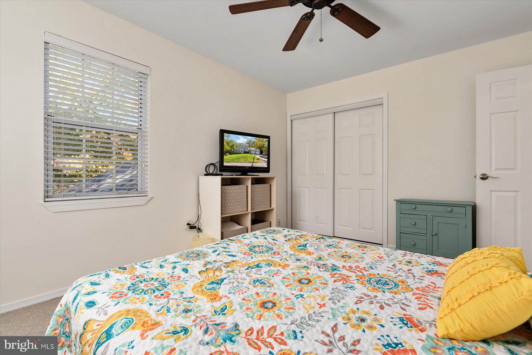 9337 Spring Water Path Jessup, MD 20794 - Photo 22 of 41 a bedroom with a bed and a tv