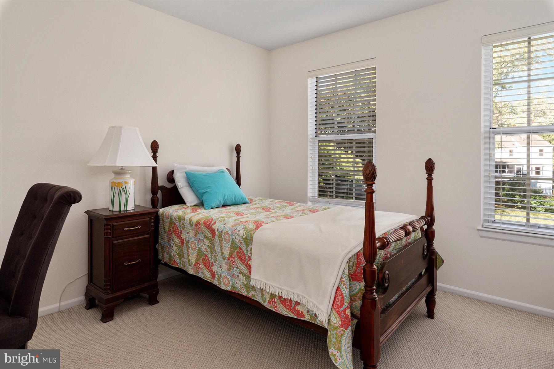 9337 Spring Water Path Jessup, MD 20794 - Photo 25 of 41 a bed sitting in a bedroom next to a window