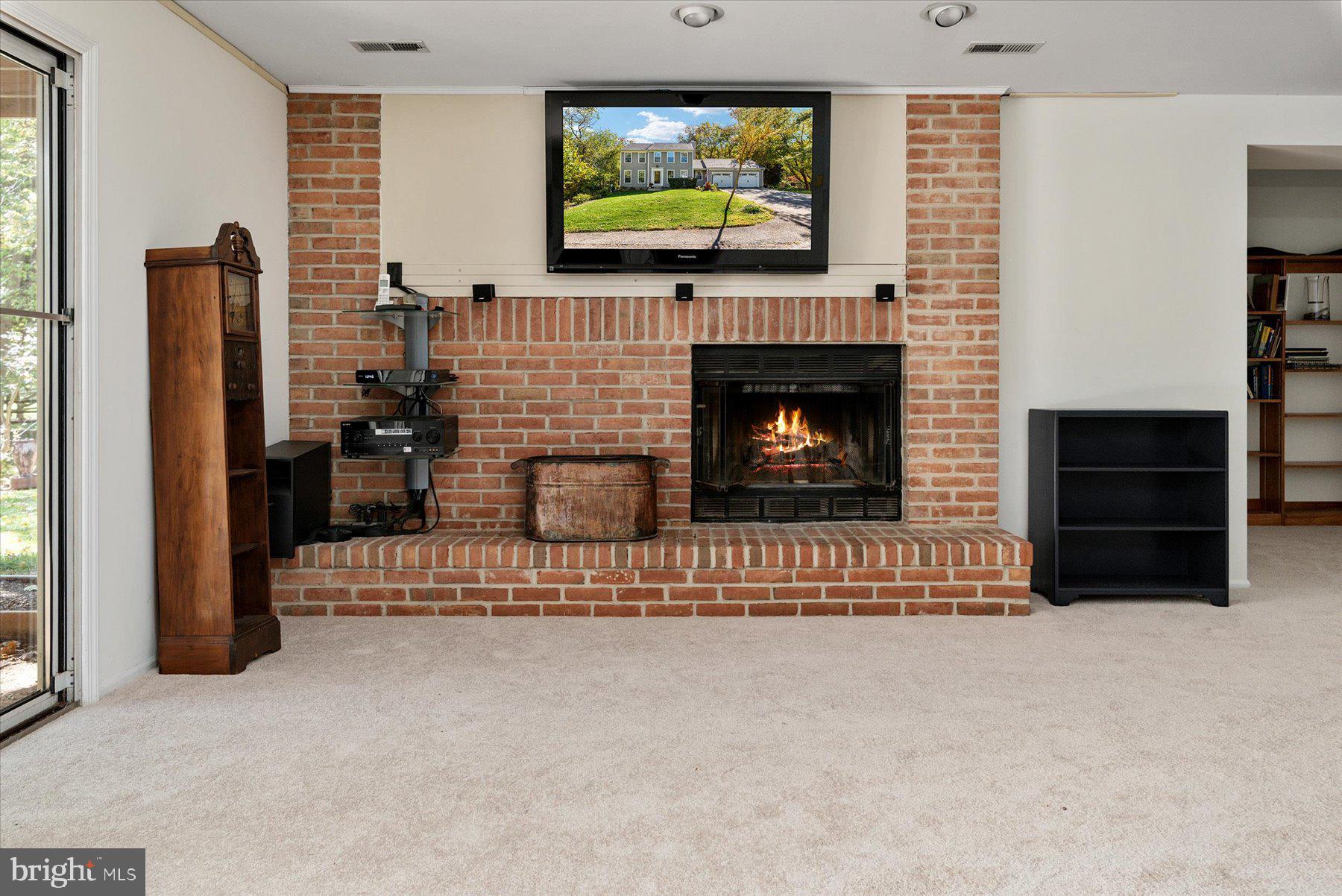 9337 Spring Water Path Jessup, MD 20794 - Photo 29 of 41 a living room with furniture and a fireplace