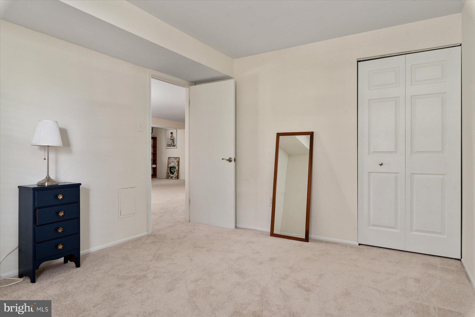 9337 Spring Water Path Jessup, MD 20794 - Photo 30 of 41 an empty room with closet and a bathroom