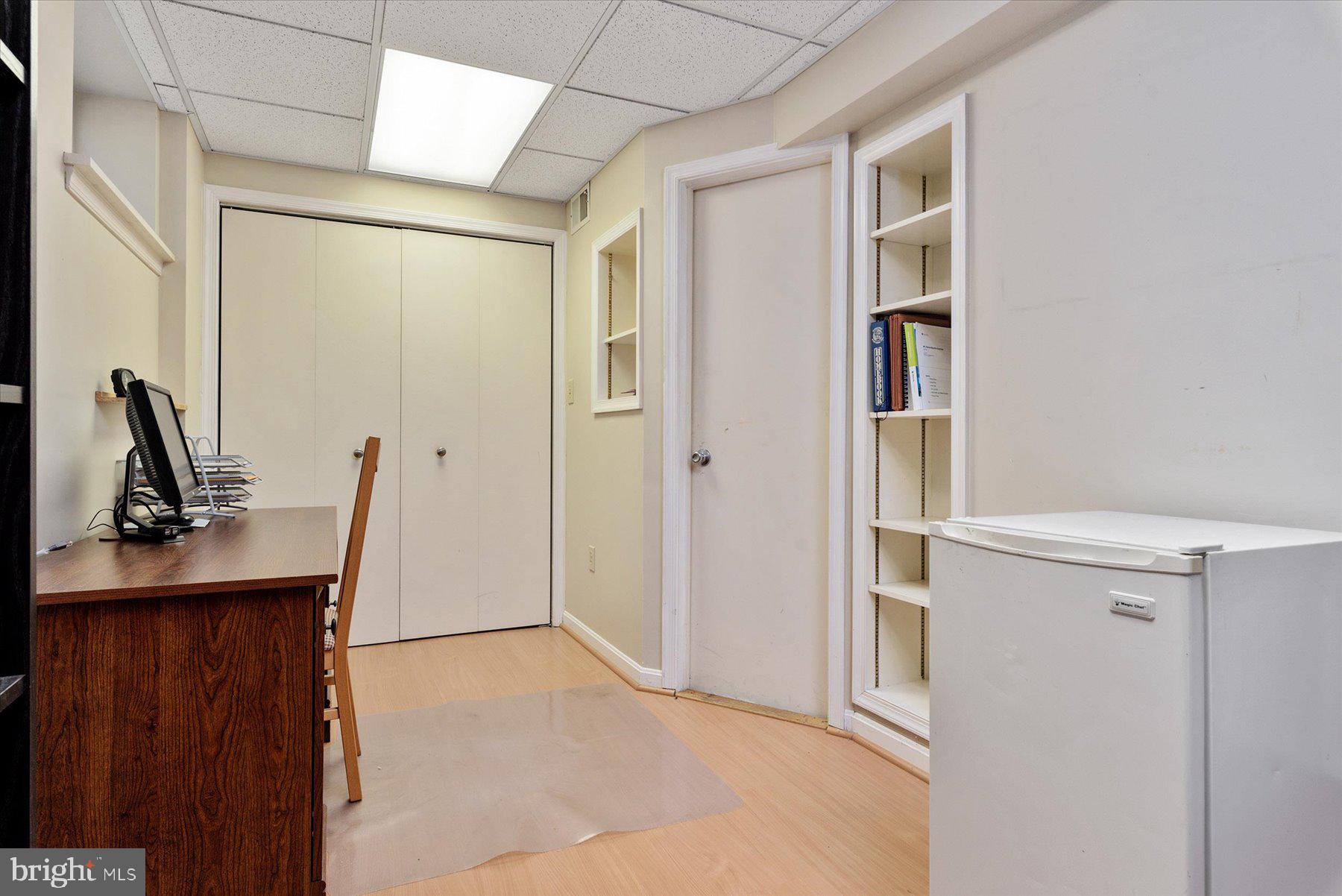 9337 Spring Water Path Jessup, MD 20794 - Photo 33 of 41 a view of cabinets with wooden floor