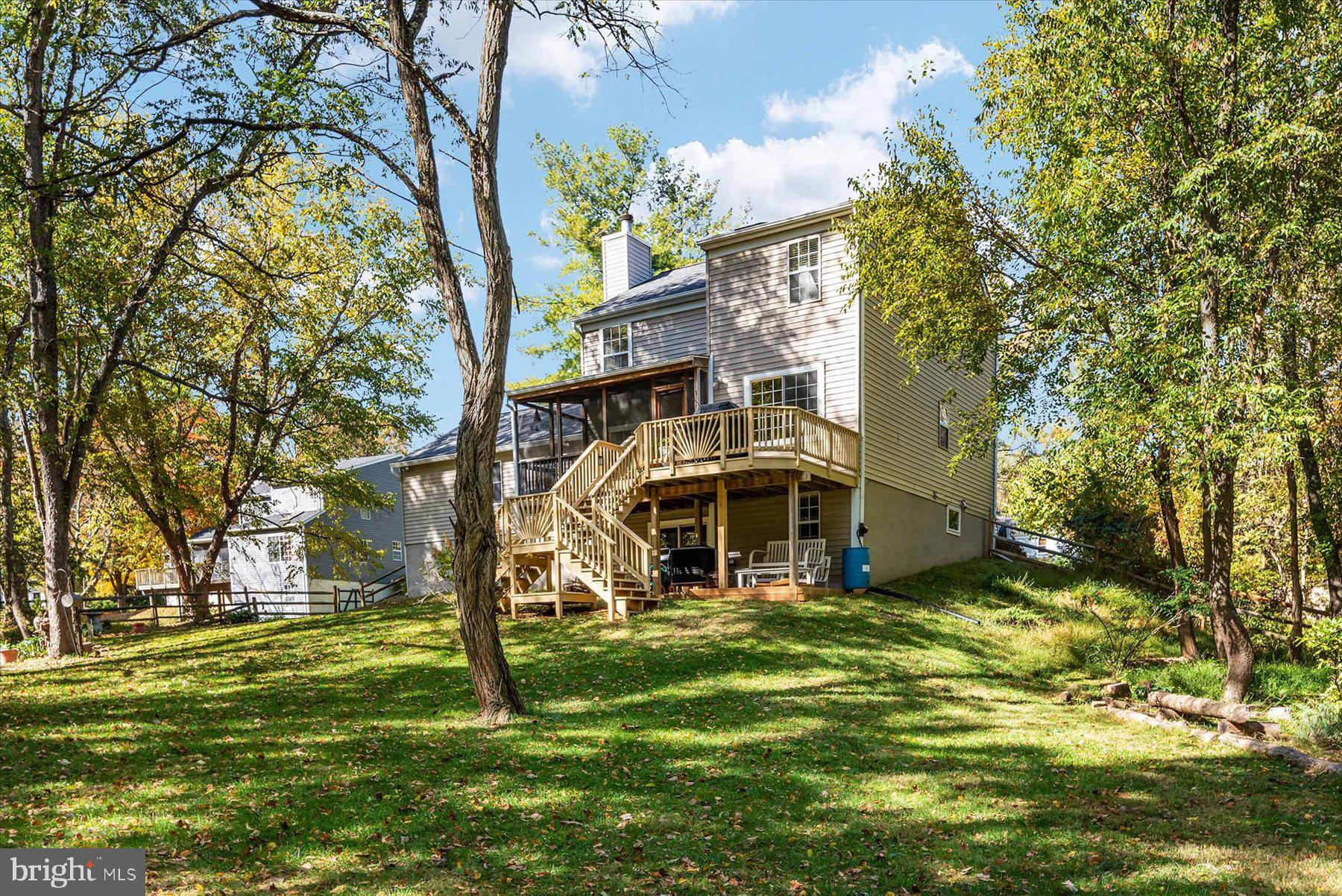 9337 Spring Water Path Jessup, MD 20794 - Photo 36 of 41 a view of a house with a big yard next to a building