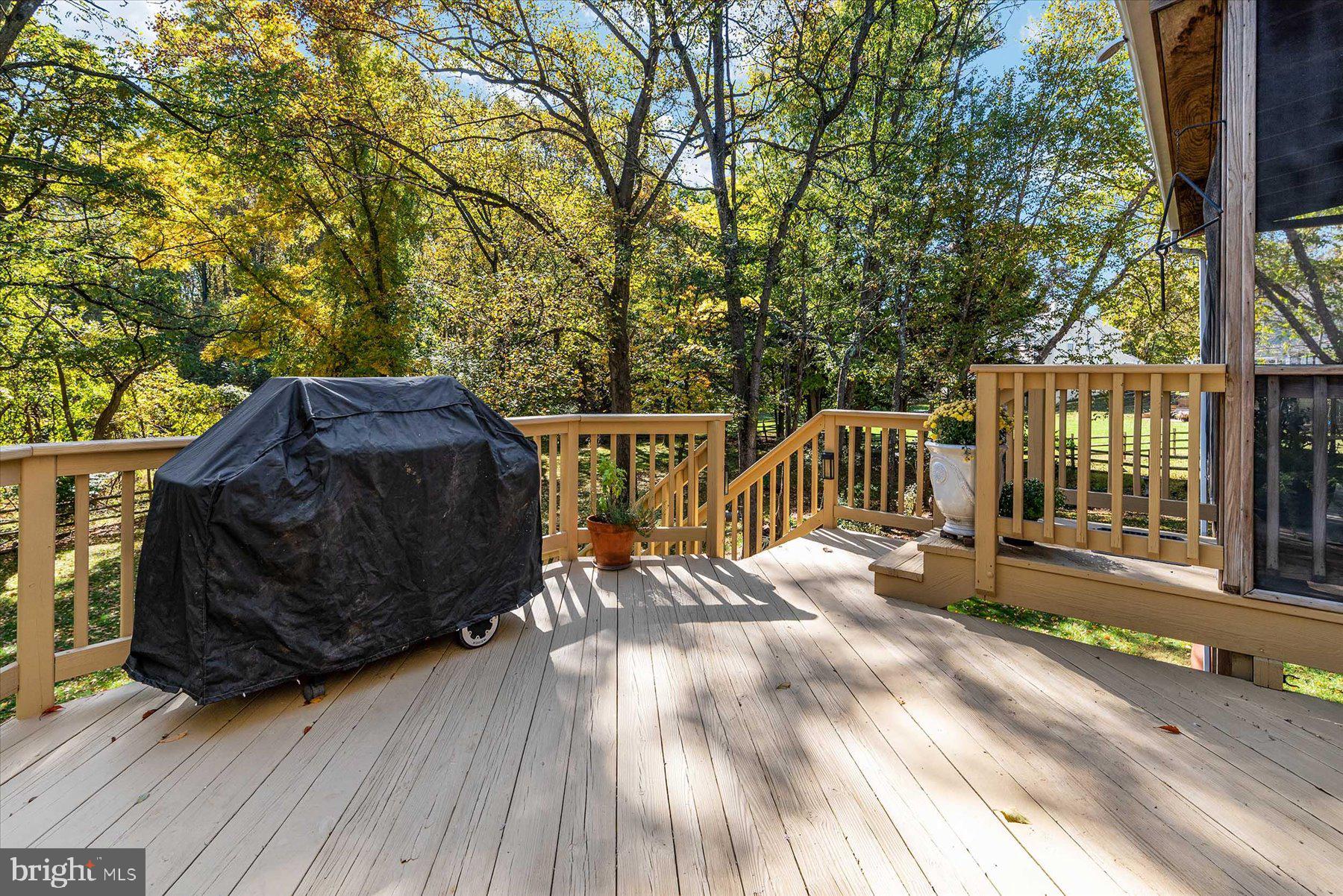 9337 Spring Water Path Jessup, MD 20794 - Photo 38 of 41 a view of balcony with wooden floor and outdoor seating