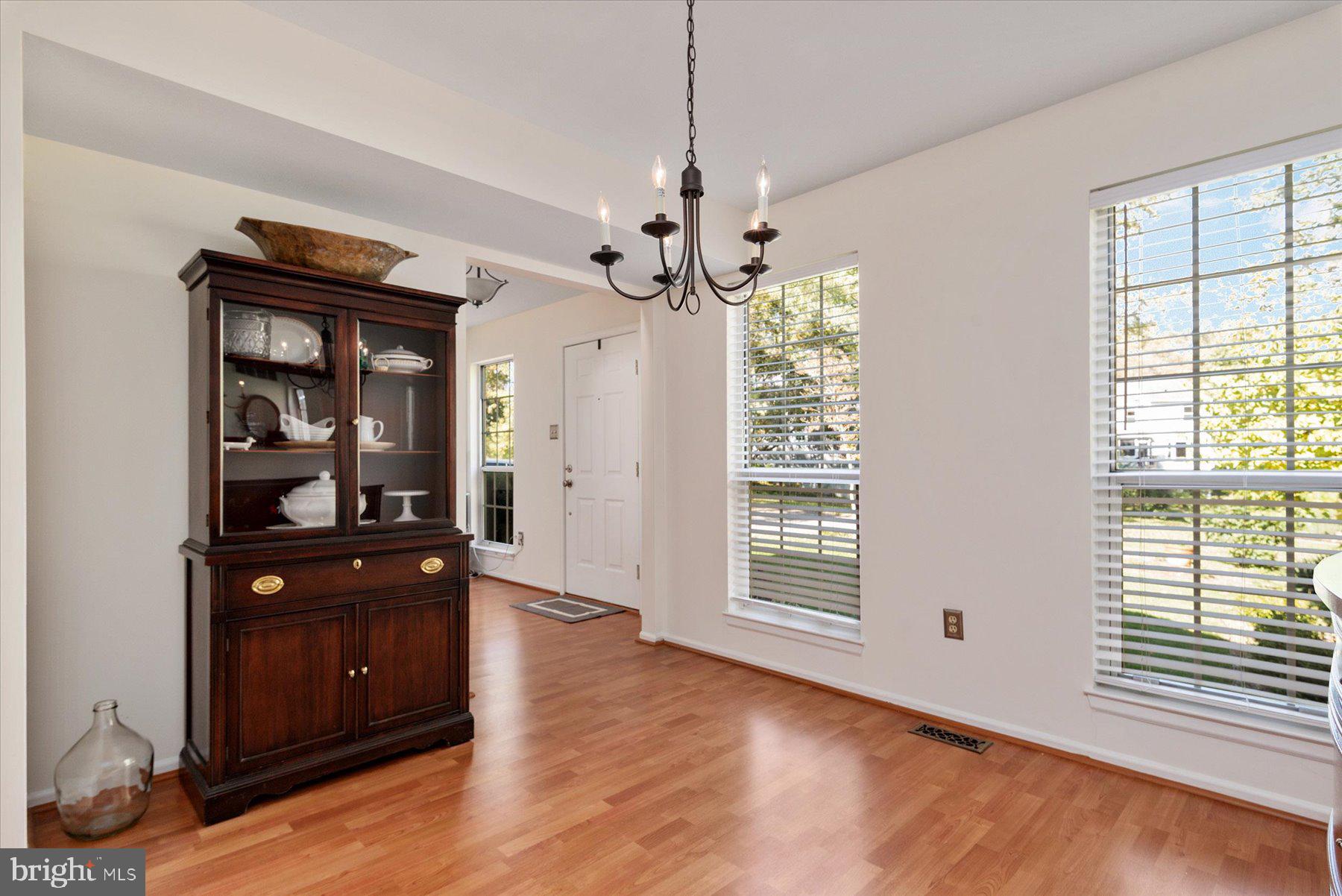 9337 Spring Water Path Jessup, MD 20794 - Photo 4 of 41 a view of a livingroom with a window and wooden floor
