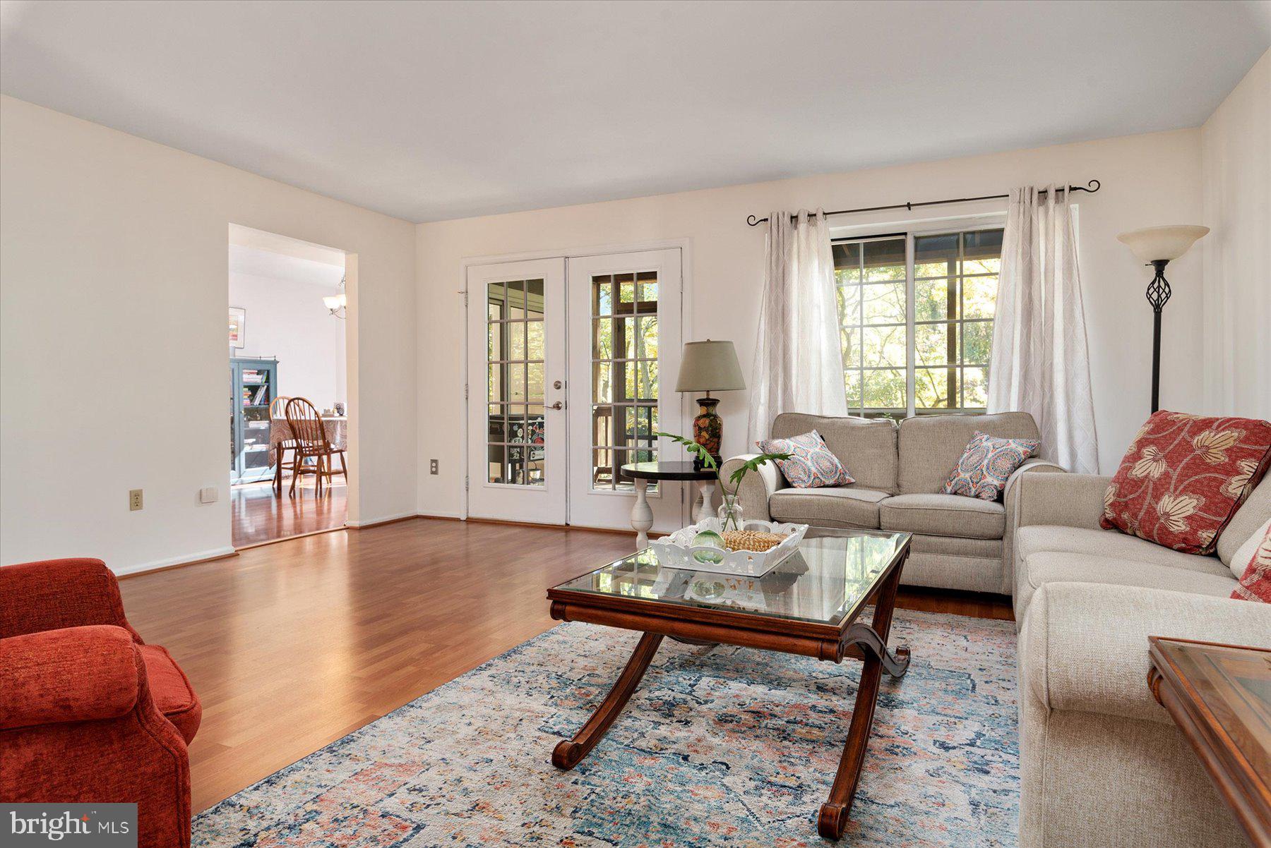 9337 Spring Water Path Jessup, MD 20794 - Photo 5 of 41 a living room with furniture and wooden floor