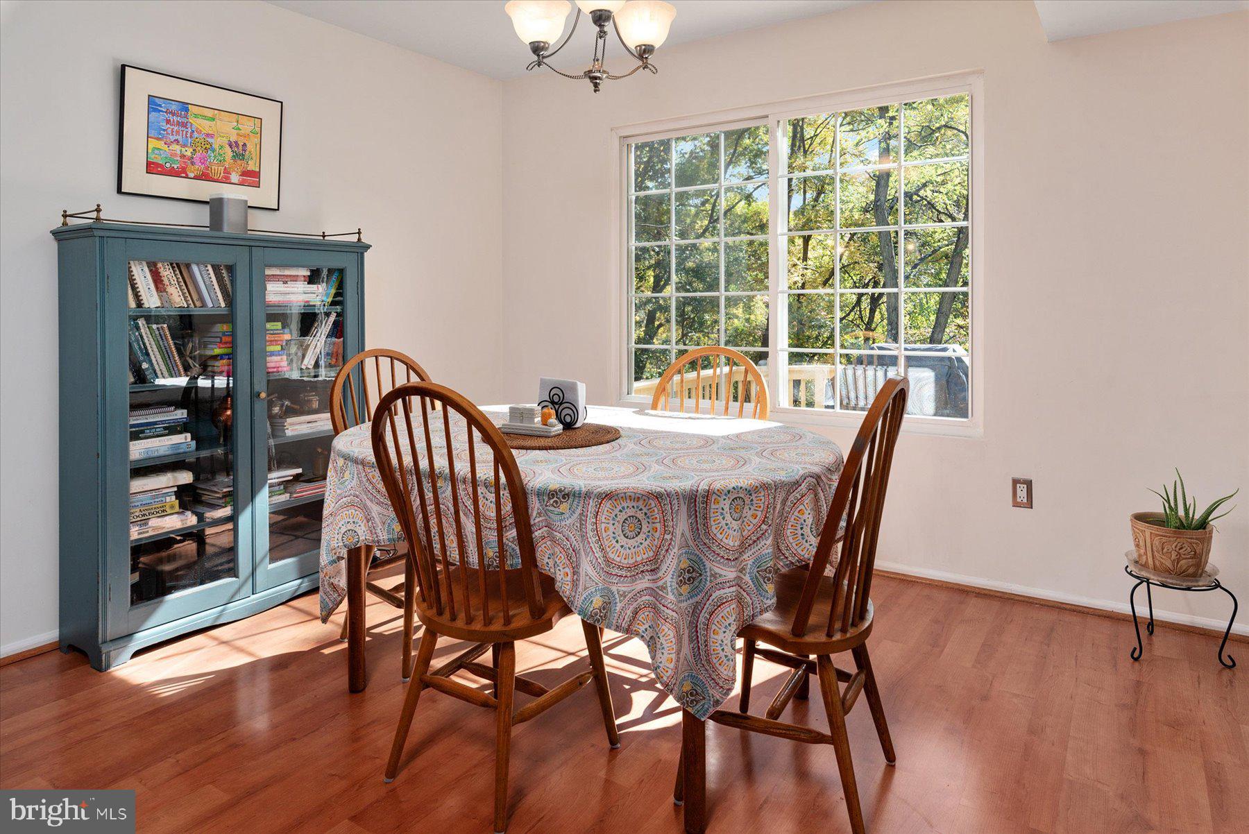 9337 Spring Water Path Jessup, MD 20794 - Photo 9 of 41 a view of a dining room with furniture window and wooden floor