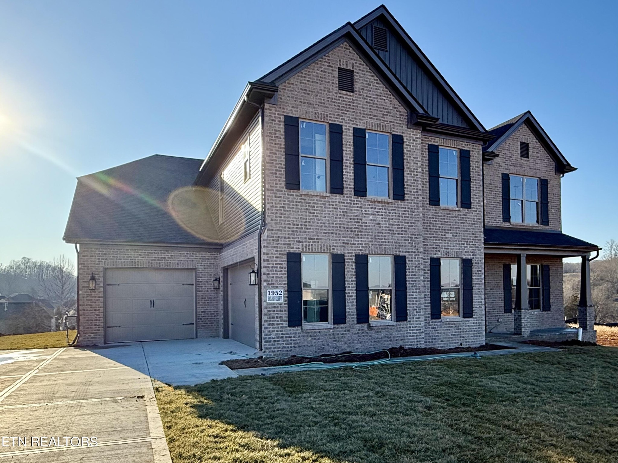 1952 Hickory Reserve Road Knoxville, TN 37932 - Photo 2 of 13 a front view of a house with a garden and yard