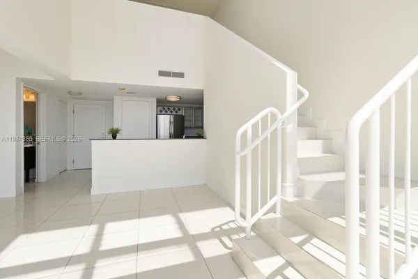 a view of a hallway with windows