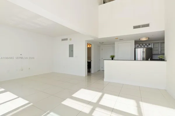 a view of a living room with furniture and a bath tub