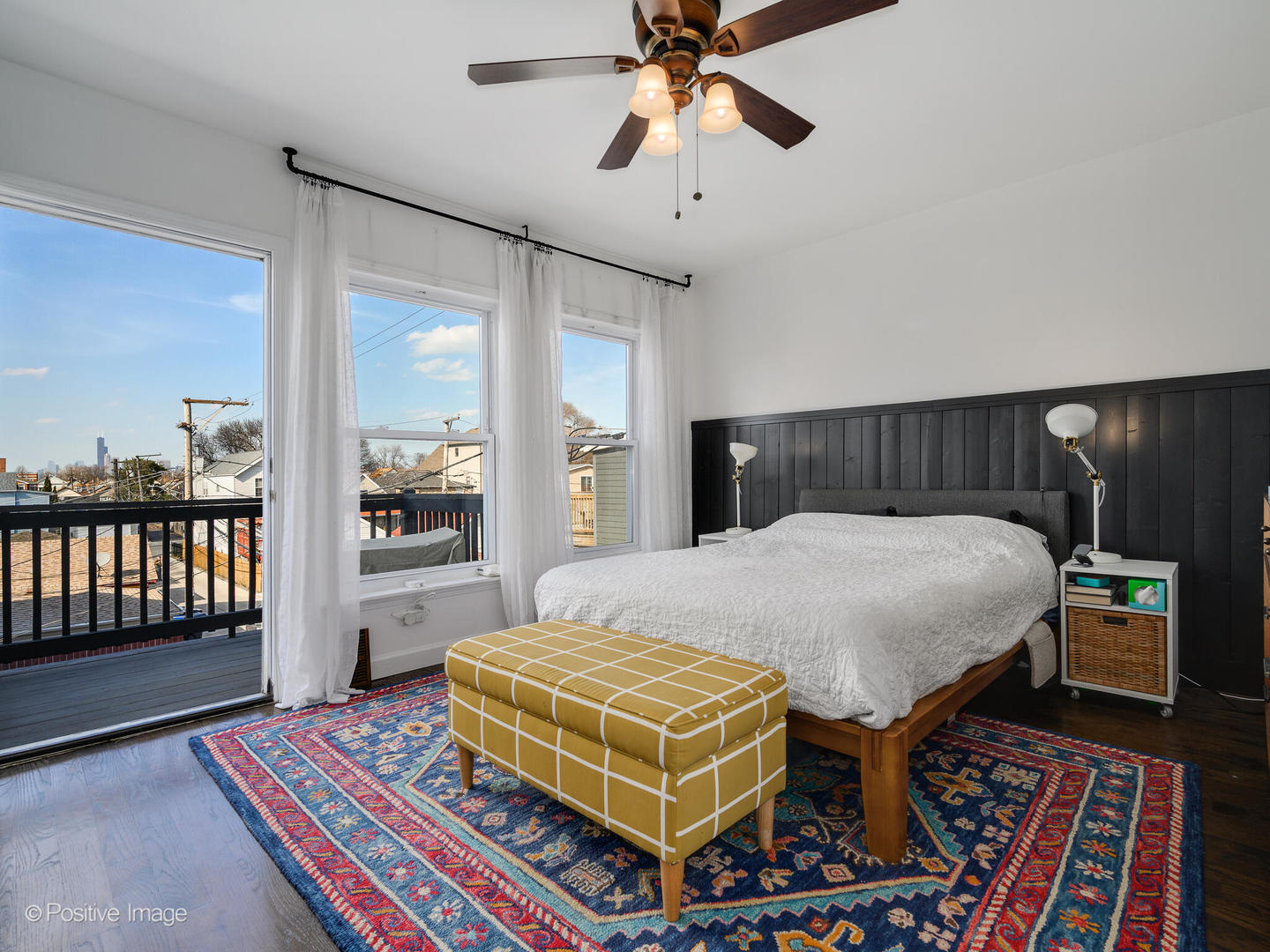 550 West 45th Street Chicago, IL 60609 - Photo 15 of 24 a bedroom with a bed bookshelf and a large window