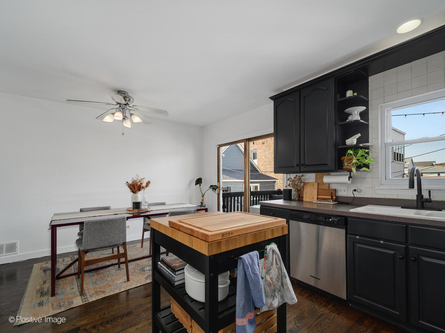 550 West 45th Street Chicago, IL 60609 - Photo 9 of 24 a kitchen with a sink cabinets and wooden floor