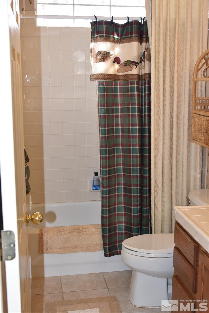 1186 Scenic Park Terrace Reno, NV 89521 - Photo 15 of 18 a bathroom with a sink toilet and shower
