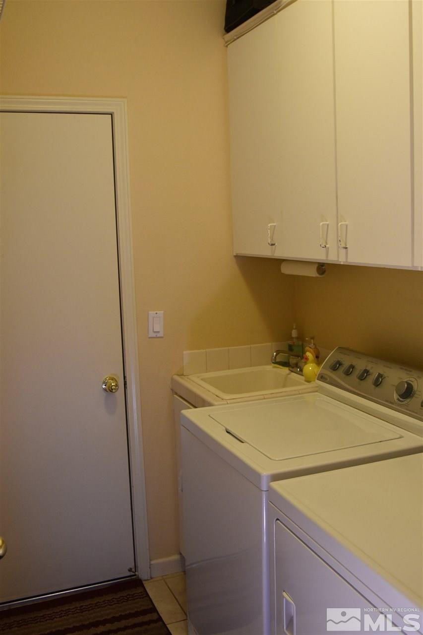 1186 Scenic Park Terrace Reno, NV 89521 - Photo 16 of 18 a bathroom with a sink and washing machine