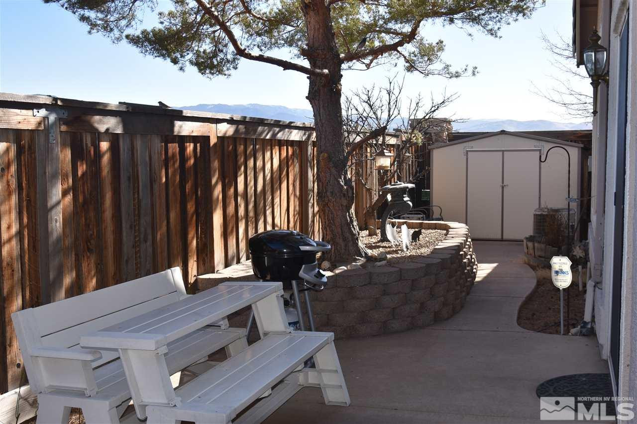 1186 Scenic Park Terrace Reno, NV 89521 - Photo 17 of 18 a view of a couches and dinning table and chairs in patio