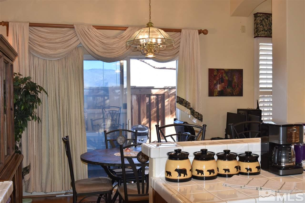 1186 Scenic Park Terrace Reno, NV 89521 - Photo 7 of 18 a view of a dining room with furniture and chandelier