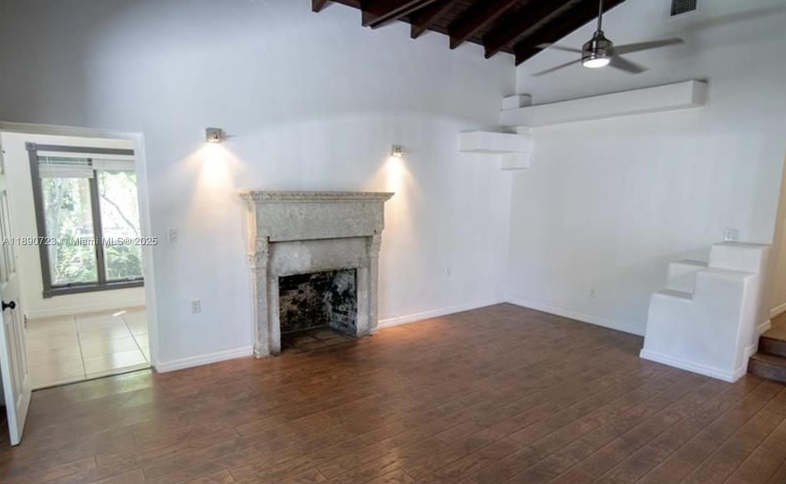 3050 Alton Road Miami Beach, FL 33140 - Photo 13 of 41 an empty room with windows and fireplace