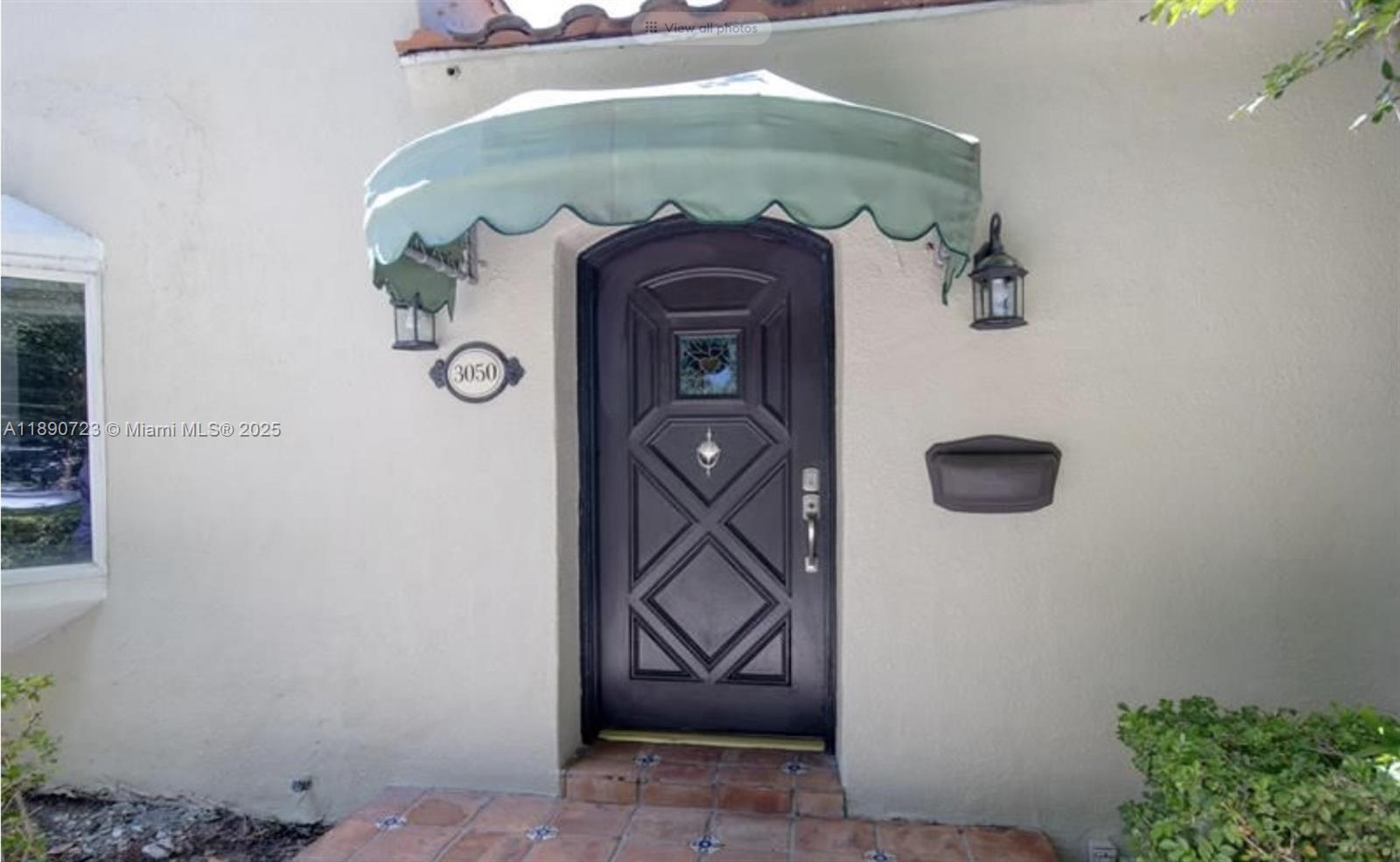 3050 Alton Road Miami Beach, FL 33140 - Photo 2 of 41 view of a door and a potted plant in a bathroom