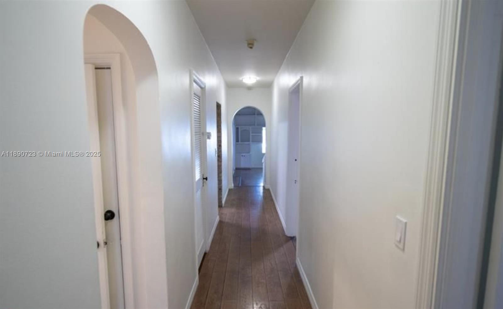 3050 Alton Road Miami Beach, FL 33140 - Photo 24 of 41 a view of a hallway with wooden floor