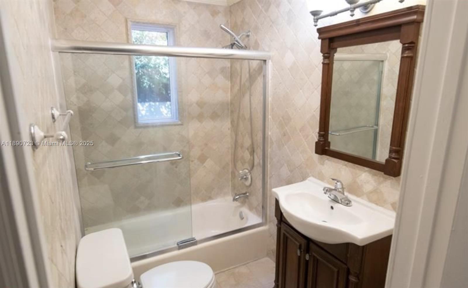 3050 Alton Road Miami Beach, FL 33140 - Photo 33 of 41 a bathroom with a sink toilet and shower