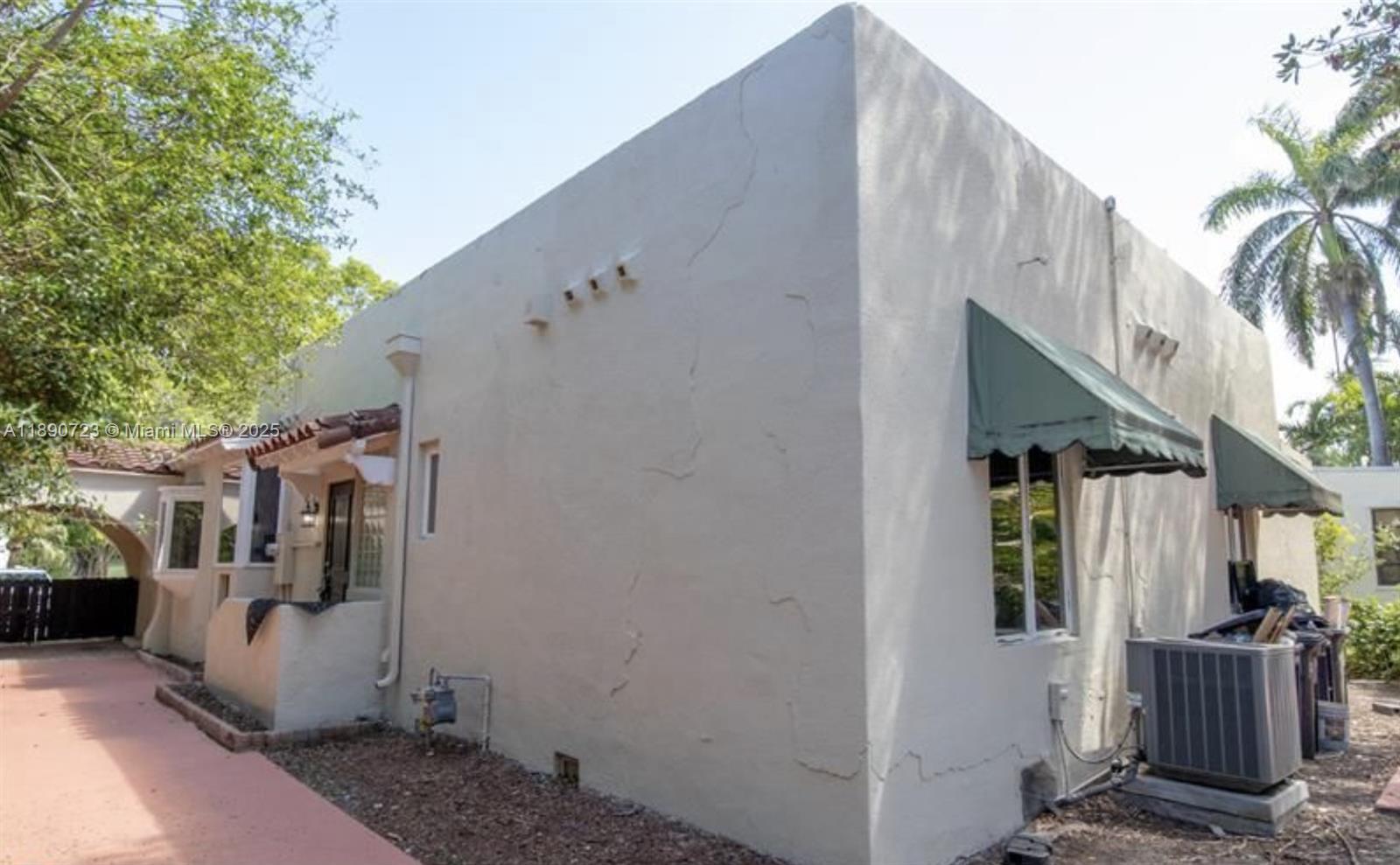 3050 Alton Road Miami Beach, FL 33140 - Photo 5 of 41 a view of a house with backyard and garden