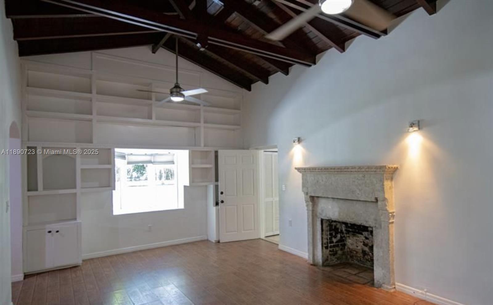 3050 Alton Road Miami Beach, FL 33140 - Photo 10 of 41 a view of empty room with a fireplace